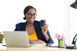 © NVB Stocker - Portrait Attractive young african american businesswoman drinking black coffee in modern home office.