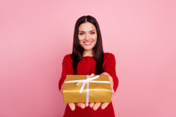 Poster - Photo of joyful brunette lady give present wear red pullover isolated on pink color background