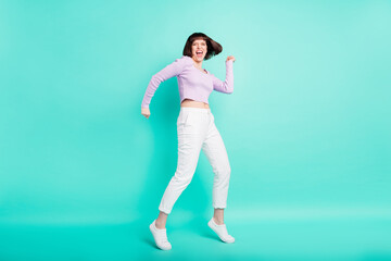 Poster - Full length photo of impressed cute young lady wear purple pullover dancing smiling isolated teal color background