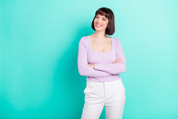 Poster - Photo portrait business woman looking copyspace smiling with crossed hands isolated bright teal color background