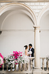 Wall Mural - Wedding couple holding hands, groom and bride together on wedding day