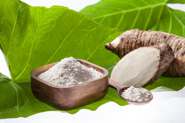 Taro Root of Colocasia esculenta and Organic Taro Flour in a bowl