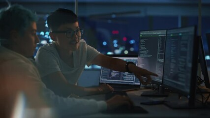 Poster - Teamwork In Diverse Office at Night: Project Manager Talks with Creative Solutions Specialist, They Discuss App Code Computer. Young Professionals Programming, Create e-Commerce Software