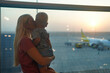 © Olleg1 - mother and son looking at the plane to the airport. Waiting flight.