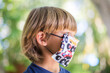 © Scopio - boy with facemask outdoor