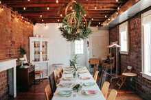 Long Dining Table Under Christmas Decoration