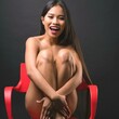 © Scopio - Studio portrait of smiling naked woman