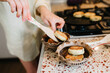 © Scopio - Woman baking bread on a pan