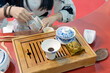 © Scopio - Woman performing Chinese tea ceremony