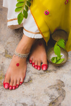 Womans Feet Painted With Henna