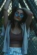 © Scopio - Woman wearing blur sunglasses