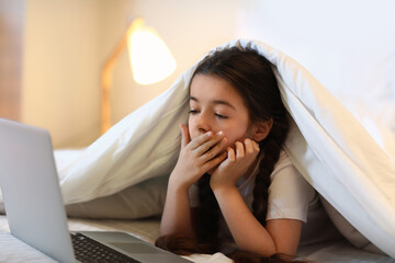 Poster - Tired girl watching cartoons in bedroom