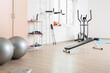 © Pixel-Shot - Interior of gym with modern equipment