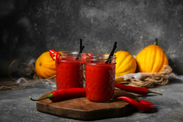 Fototapeta glasses of tasty bloody mary cocktail decorated for halloween on dark background