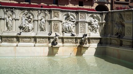 Wall Mural - Panoramic View of Fonte Gaia monumental fountain at the Piazza del Campo square in Siena city, Tuscany, Italy. built in 1419