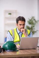 Young male architect working in the office