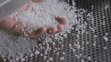 Plastic Granules On A Vibrating Table. Polymer Compound Production