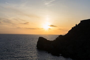 Poster - Sunset on a beautiful spring day with calm sea, seen from Anchor Bay, Mellieha, Malta.