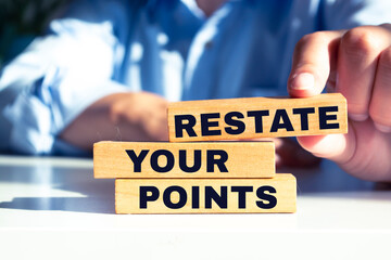 Text sign showing RESTATE YOUR POINTS