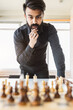 © xartproduction - planning strategy with chess figures on an old wooden table