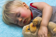 Sleeping Baby Boy With Toy Monkey