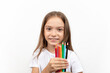 © Emir - education and creativity concept. Little student girl with colorful crayons on white background.
