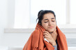 © SHOTPRIME STUDIO - woman covered with a blanket sits on the couch health problems cold treatment