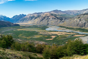 Wall Mural - the turns river with a spectacular view of the valley landscape with the glacial river as a highlight. El Chalten, Santa Cruz, Argentina.