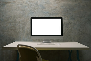 Poster - White blank screen computer monitor putting on the modern desk over cement wall as a background.