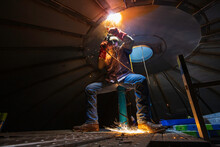 Welding Male Worker Metal Arc Is Part Roof Tank Dome Inside Confined Spaces.