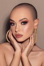 Vertical Shot Of A Gorgeous Attractive Bald Female Model With Glam Makeup