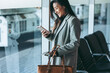 © Jacob Lund - Business traveler waiting for her plane at airport