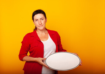 a woman in a classic red suit with a sign for writing text in her hands. Business concept