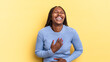 afro black pretty woman laughing out loud at some hilarious joke, feeling happy and cheerful, having fun