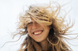 © Pietro Karras/Stocksy - Blond happy woman with messy hair