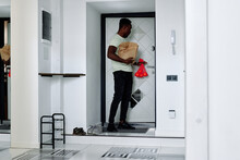 Man With Product Returning Home 