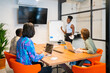 © Luis Velasco/Stocksy - Colleagues In A Coworking Workplace.