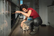 © Kike Arnaiz/Stocksy - young lady at home with her pet