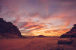 © Kike Arnaiz/Stocksy - Picturesque view of high stone hills in desert and cloudy blue sky