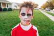 © Jessica Klaus/Stocksy - Boy with creepy face paint on.