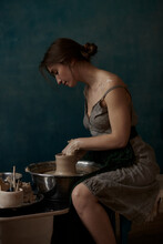 Girl Behind A Potter's Wheel
