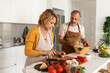 © Valentina Barreto/Stocksy - Senior couple cooking together at home