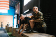 © Ezequiel Giménez/Stocksy - Physical trainers giving a demonstration at the gym