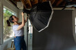 © Jayme Burrows/Stocksy - Photographer Fixes Flash Equipment