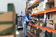 © Javier Pardina/Stocksy - Volunteer woman preparing food packages