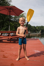Little Boy With A Paddle