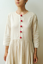 Young Woman In Linen Dress With Raspberries On Buttons
