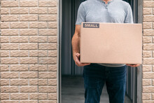 Storage: Man Holding Carboard Box By Unit Door