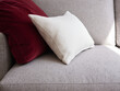 © Miquel Llonch/Stocksy - Soft cushions on gray couch