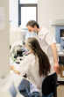 © Santi Nuñez/Stocksy - Medical Workers Working together in lab